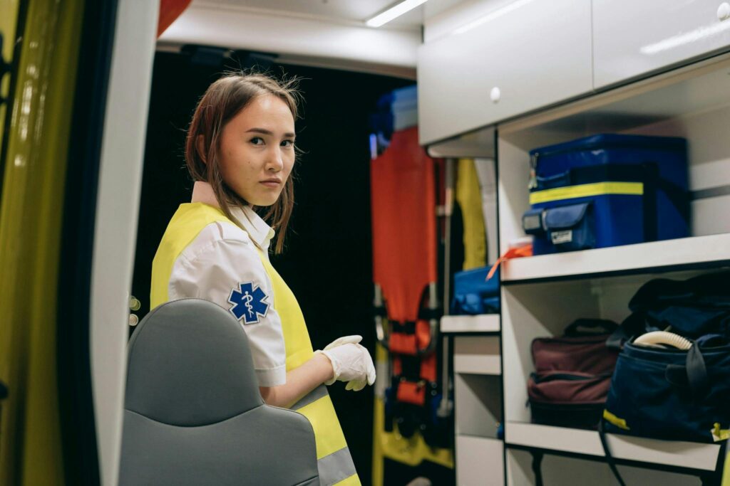Never Run Out of Ideas: Top Tips for Generating Fresh Blog Topics 2 Young female paramedic inside an ambulance wearing a reflective vest at night.